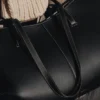 Édition Cyme : noir texturé avec surpiqûres écru