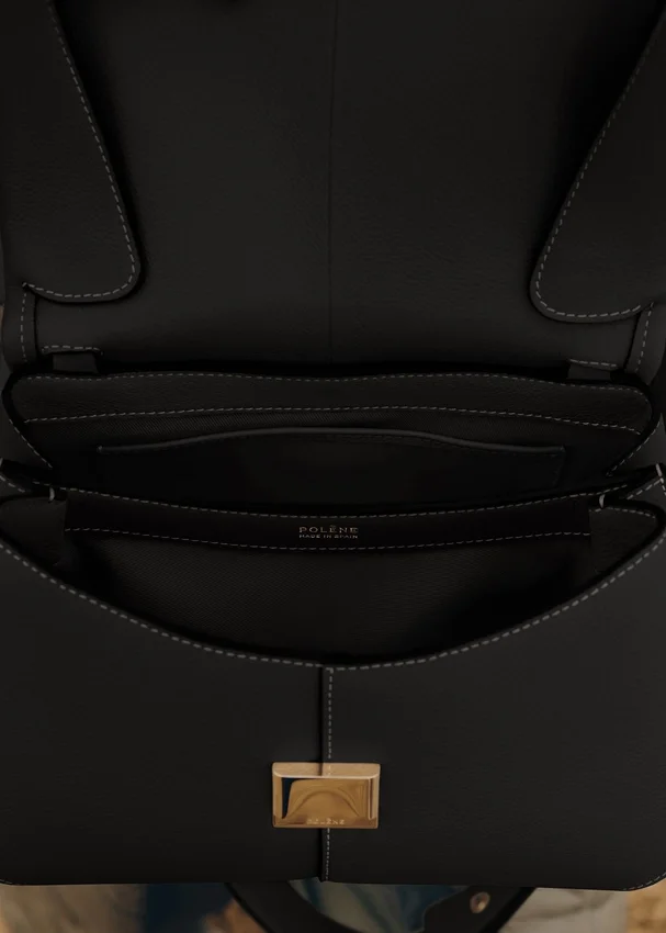 Mokki Edition Noir texturé avec surpiqûres écru