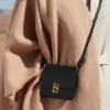 Numéro Sept Crossbody, édition portefeuille, noir texturé